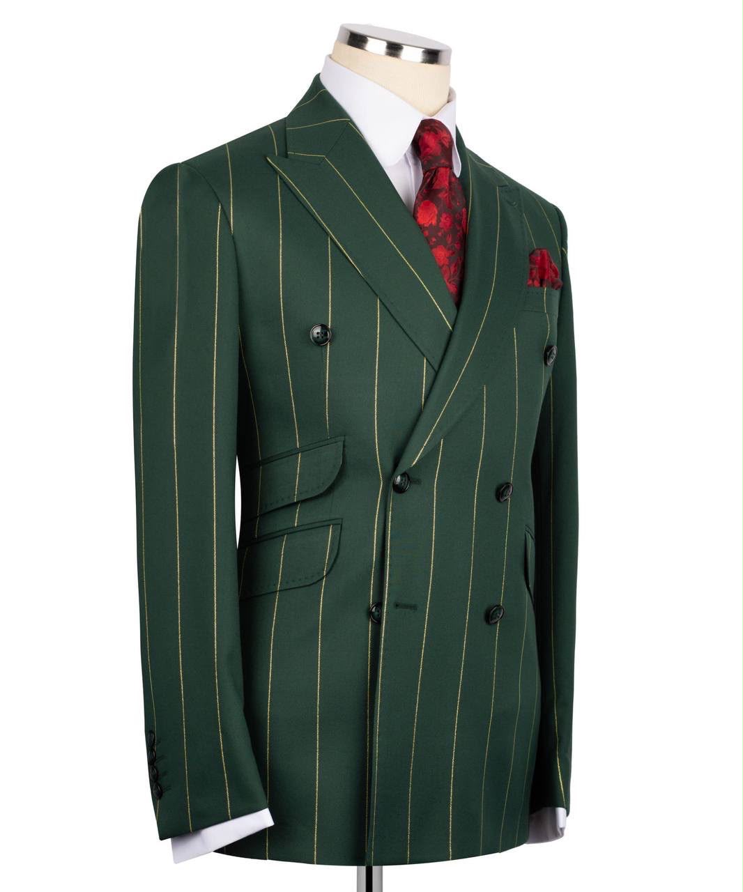 Green pinstripe suit on a mannequin with a white shirt, red patterned tie, and pocket square.