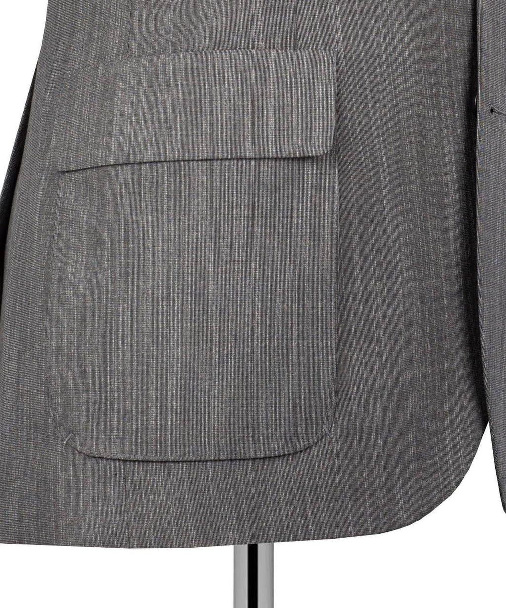 Close-up of a gray textured blazer jacket with a single front flap pocket, displayed on a mannequin against a white background.