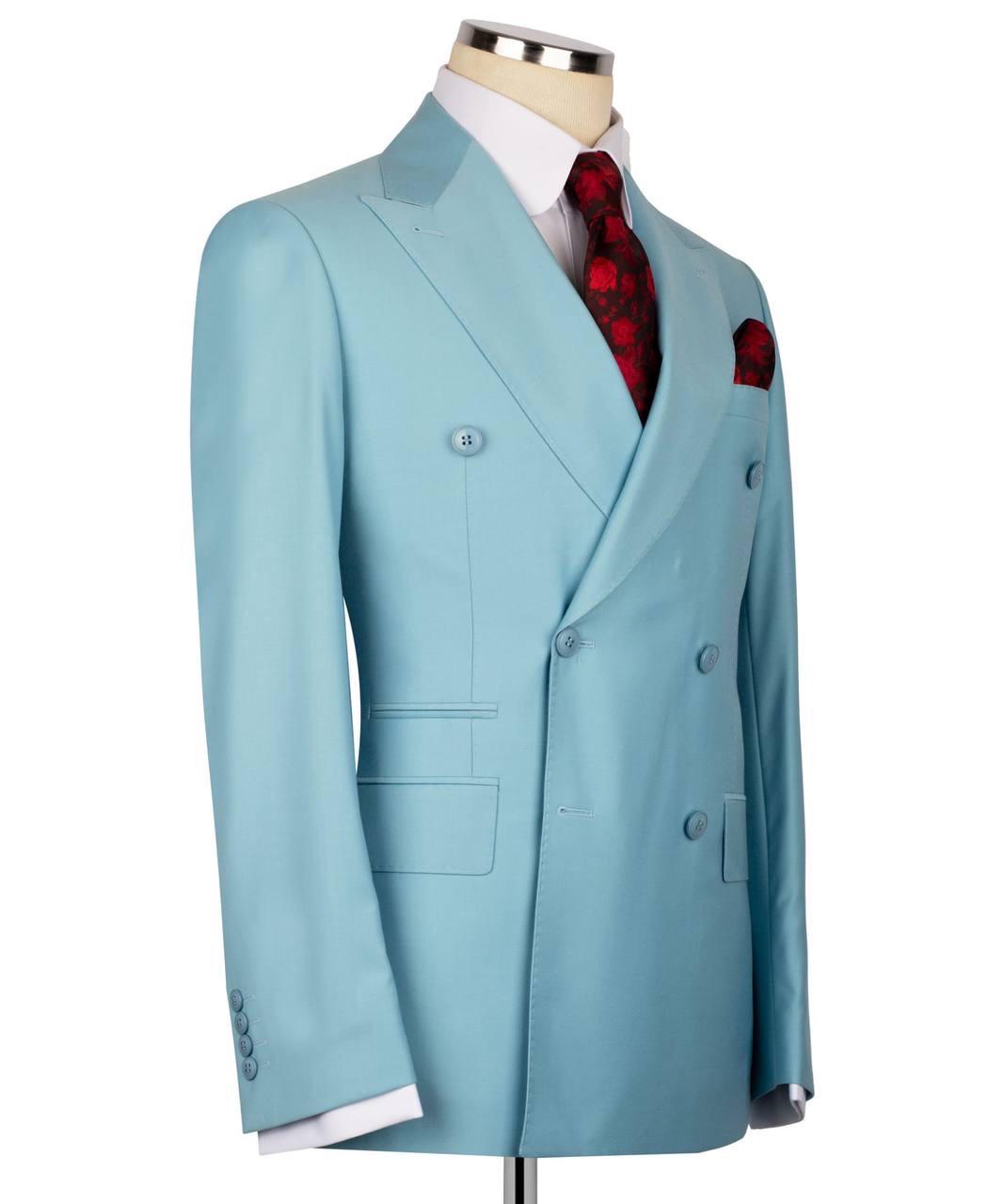 A light blue double-breasted suit jacket displayed on a mannequin torso, styled with a white dress shirt, a red patterned tie, and a matching red pocket square against a plain white background.