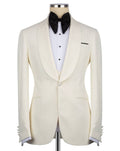 An ivory textured tuxedo jacket displayed on a mannequin torso, styled with a white pinstripe shirt, a black bow tie, and a black pocket square 