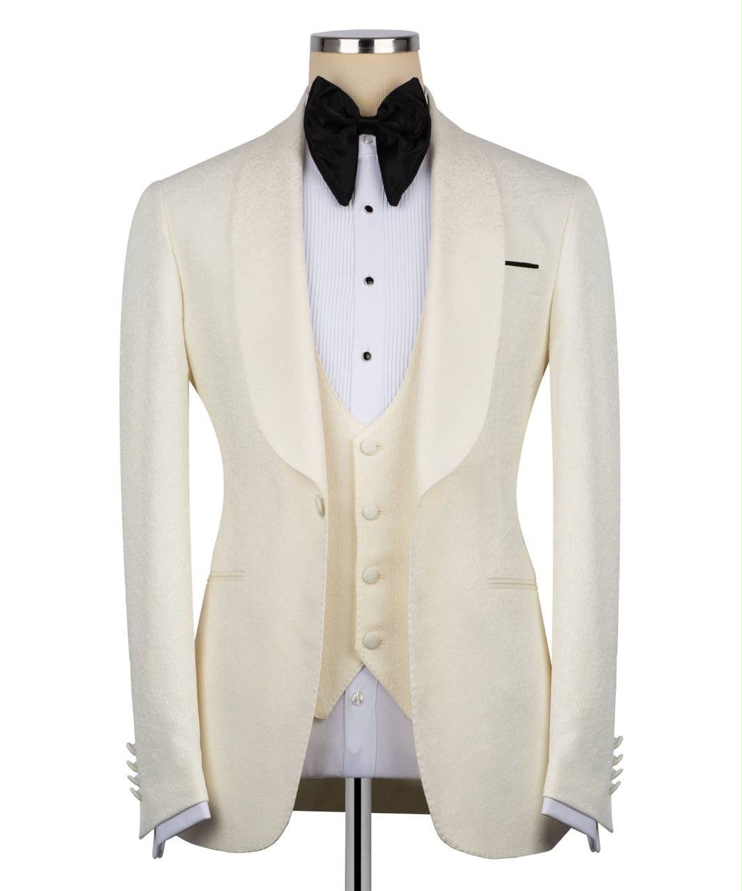 White tuxedo jacket with black bow tie on a mannequin 