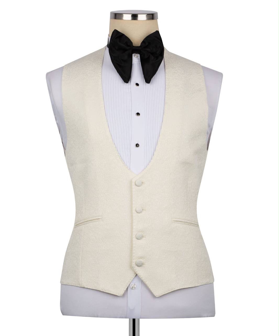 Beige vest with black bow tie on a mannequin 