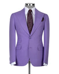 A lavender purple single-breasted suit jacket displayed on a mannequin torso, styled with a white dress shirt, a dark brown paisley tie, and a matching pocket square against a light gray background.