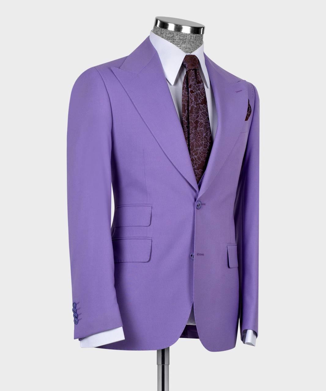 A lavender purple single-breasted suit jacket displayed on a mannequin torso, styled with a white dress shirt and a dark patterned tie against a light gray background.