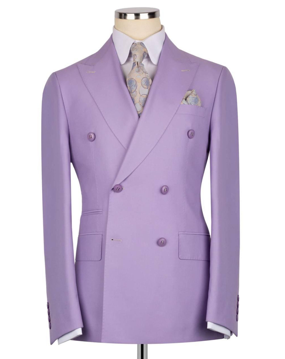 A lavender double-breasted suit jacket displayed on a mannequin torso, styled with a white dress shirt, a patterned tie, and a matching pocket square against a plain white background.