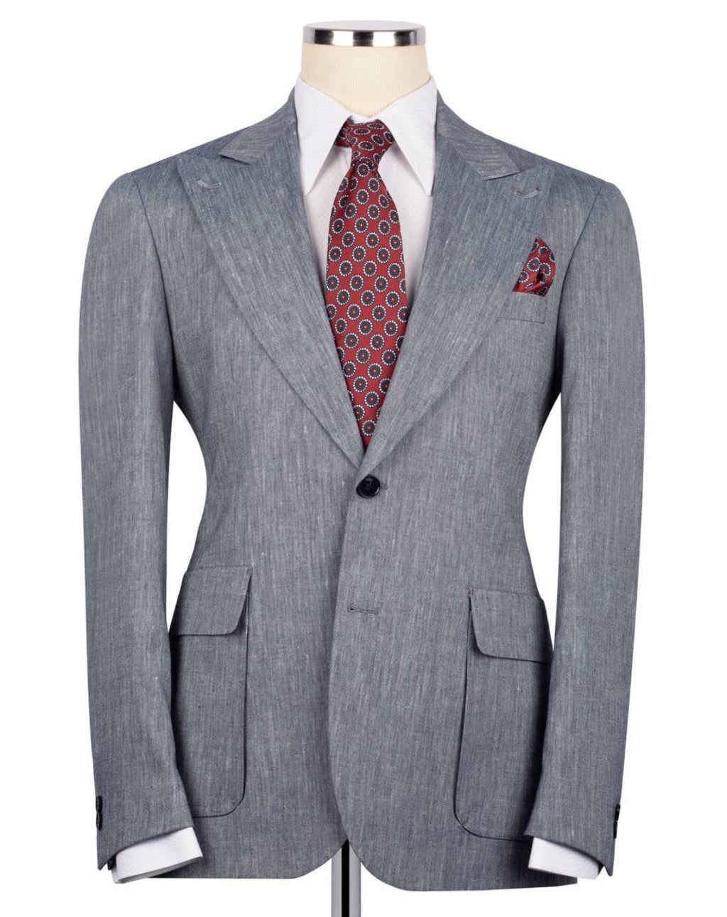 Gray suit jacket with a red patterned tie and pocket square on a mannequin against a white background