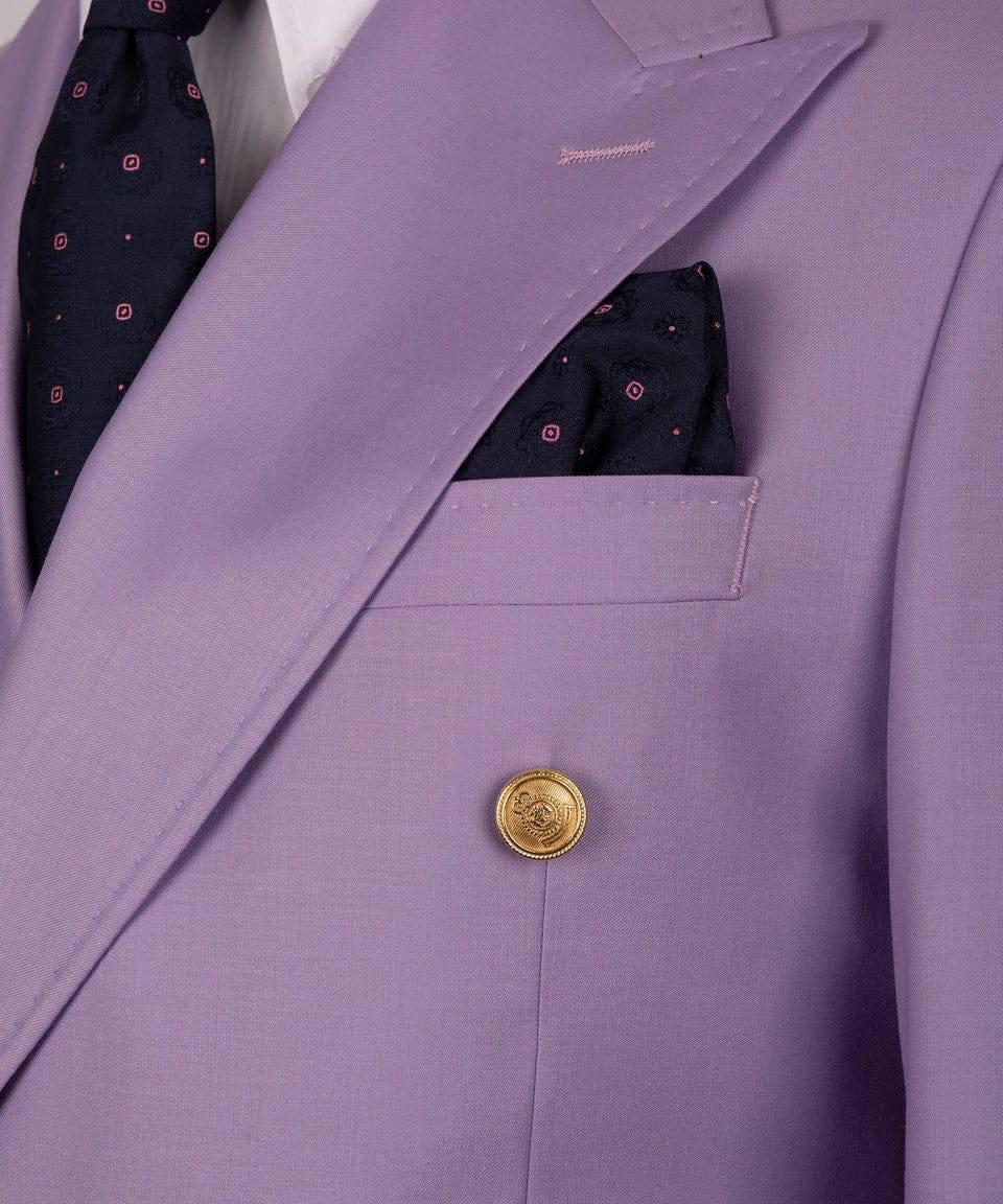 A close-up of a lavender purple double-breasted suit jacket with a gold button, a patterned navy blue tie, and a matching pocket 