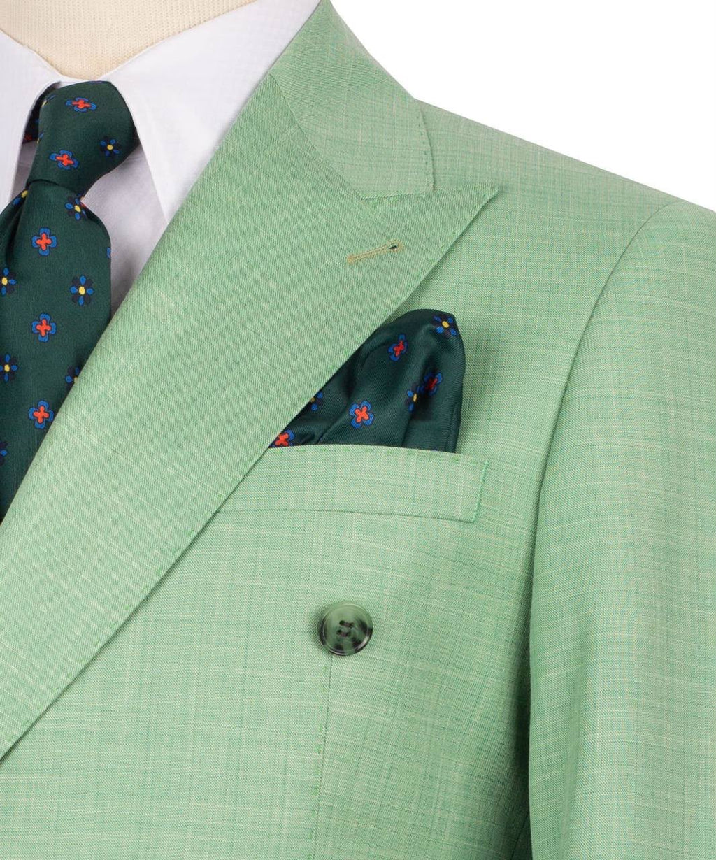 Green suit jacket with matching pocket square and tie on a white background