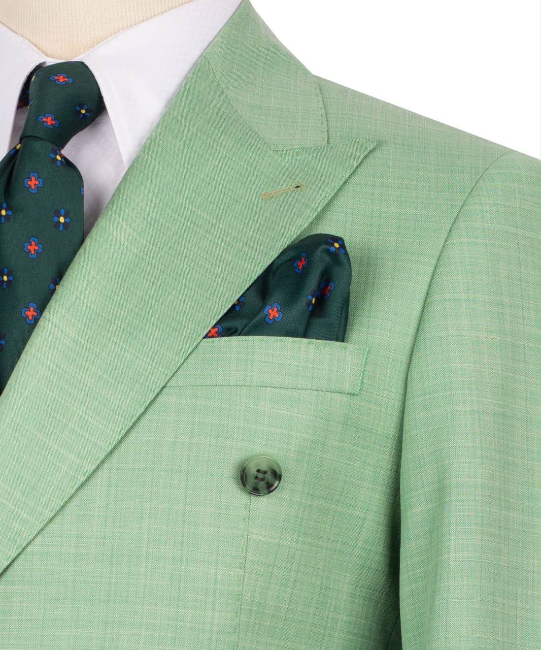 Green suit jacket with matching pocket square and tie on a white background