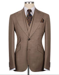 Brown suit jacket on a mannequin with a white shirt, patterned tie, and pocket square.