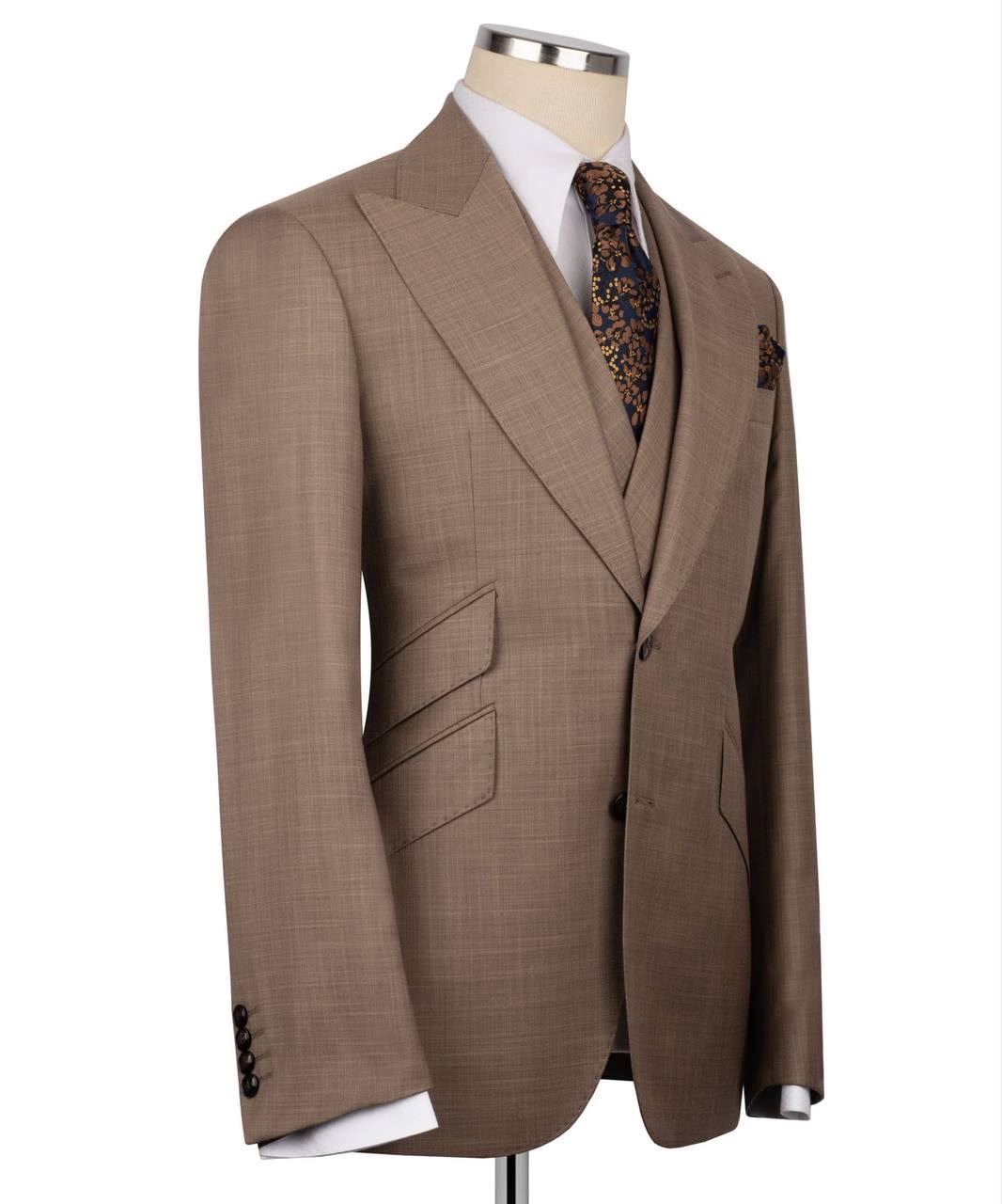 Brown suit jacket on a mannequin with a white background