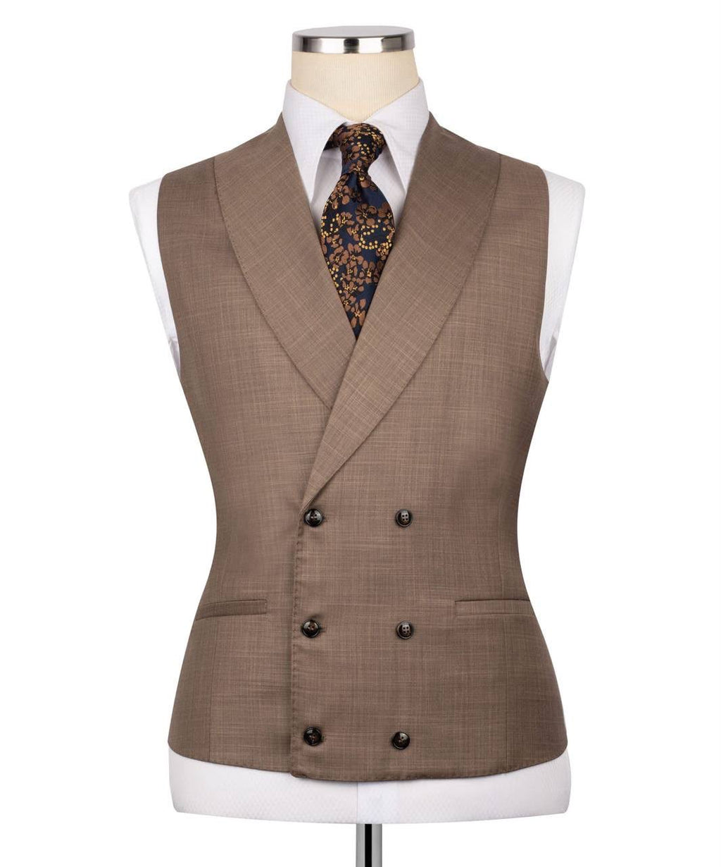 Brown suit vest on a mannequin with a white shirt and patterned tie.