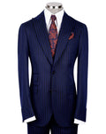A navy blue pinstripe suit jacket displayed on a mannequin torso, styled with a white dress shirt, a red paisley patterned tie, and a matching red pocket square