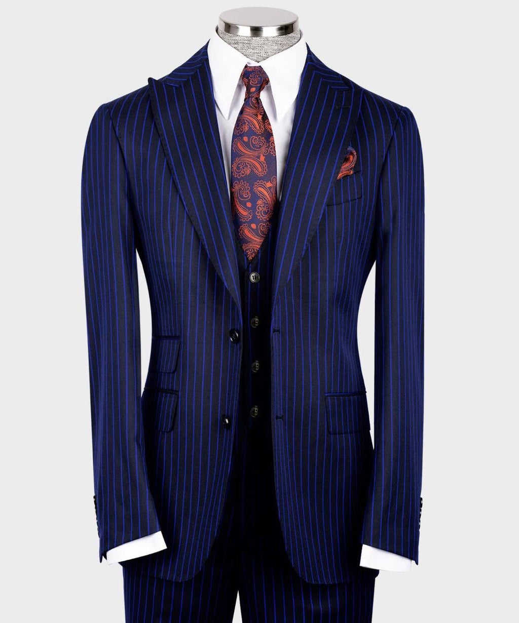 Blue pinstripe suit with a patterned tie on a mannequin 