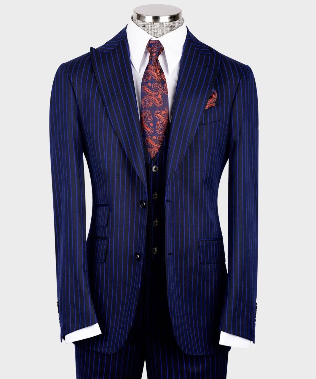 Blue pinstripe suit with a patterned tie on a mannequin 