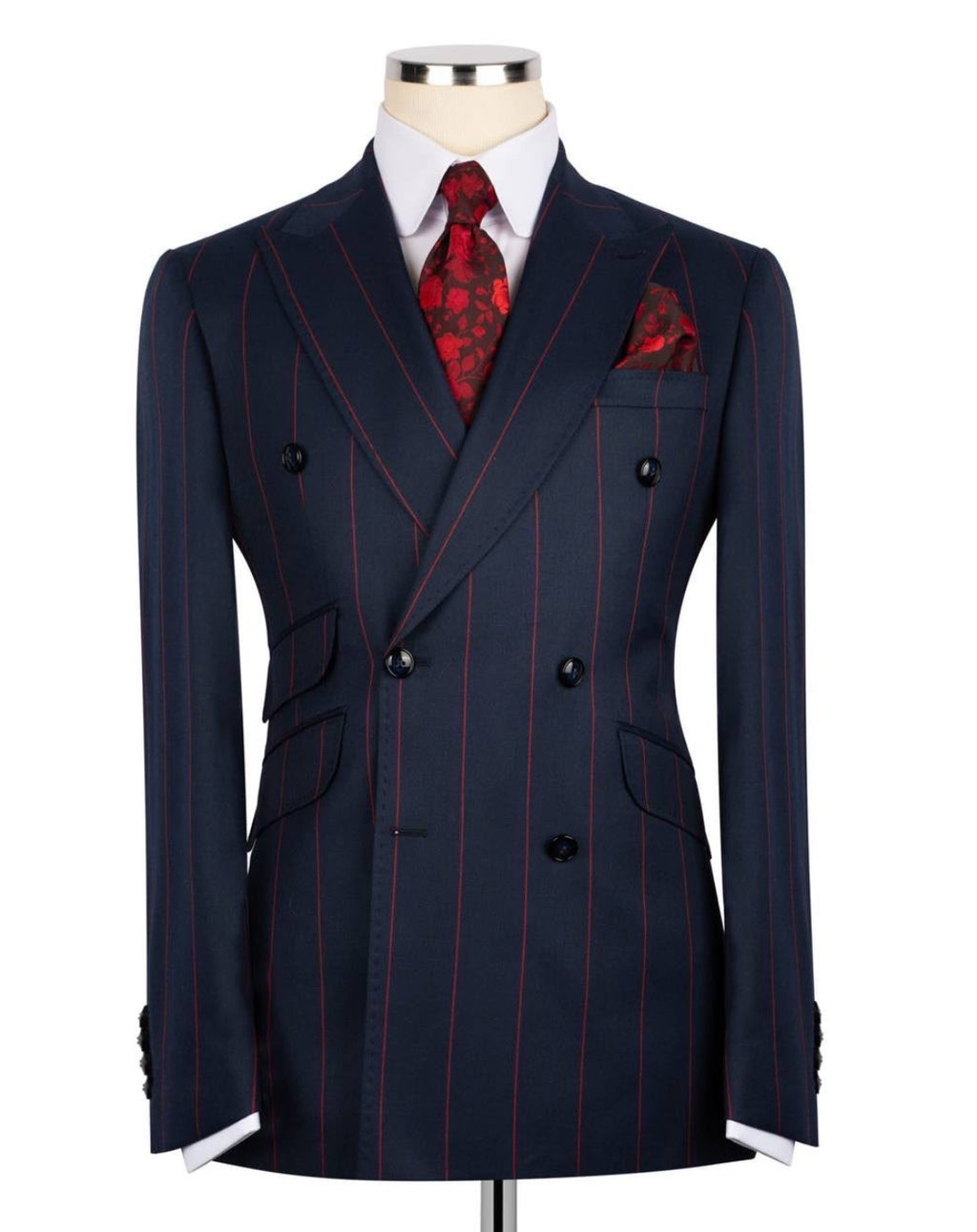 Navy pinstripe suit with red accents on a mannequin against a white background