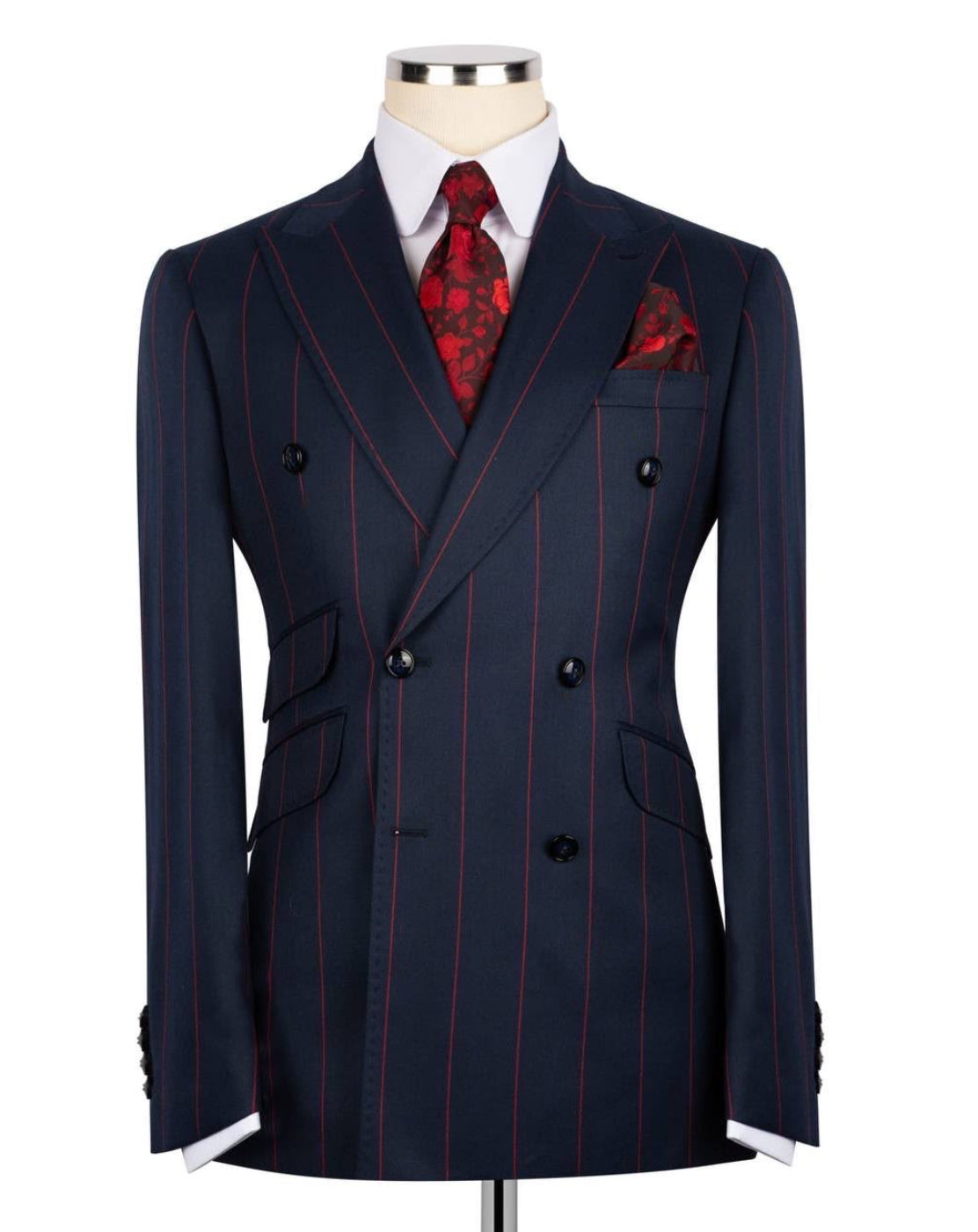 Navy pinstripe suit with red accents on a mannequin against a white background