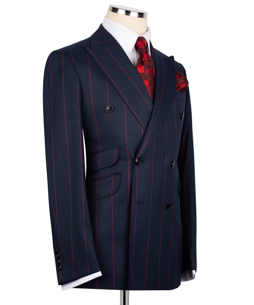 Navy pinstripe suit jacket on a mannequin with a white shirt and red patterned tie.