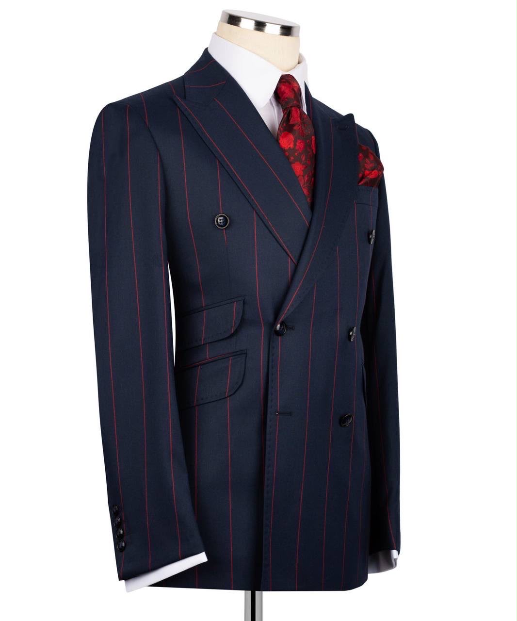 Navy pinstripe suit jacket on a mannequin with a white shirt and red patterned tie.