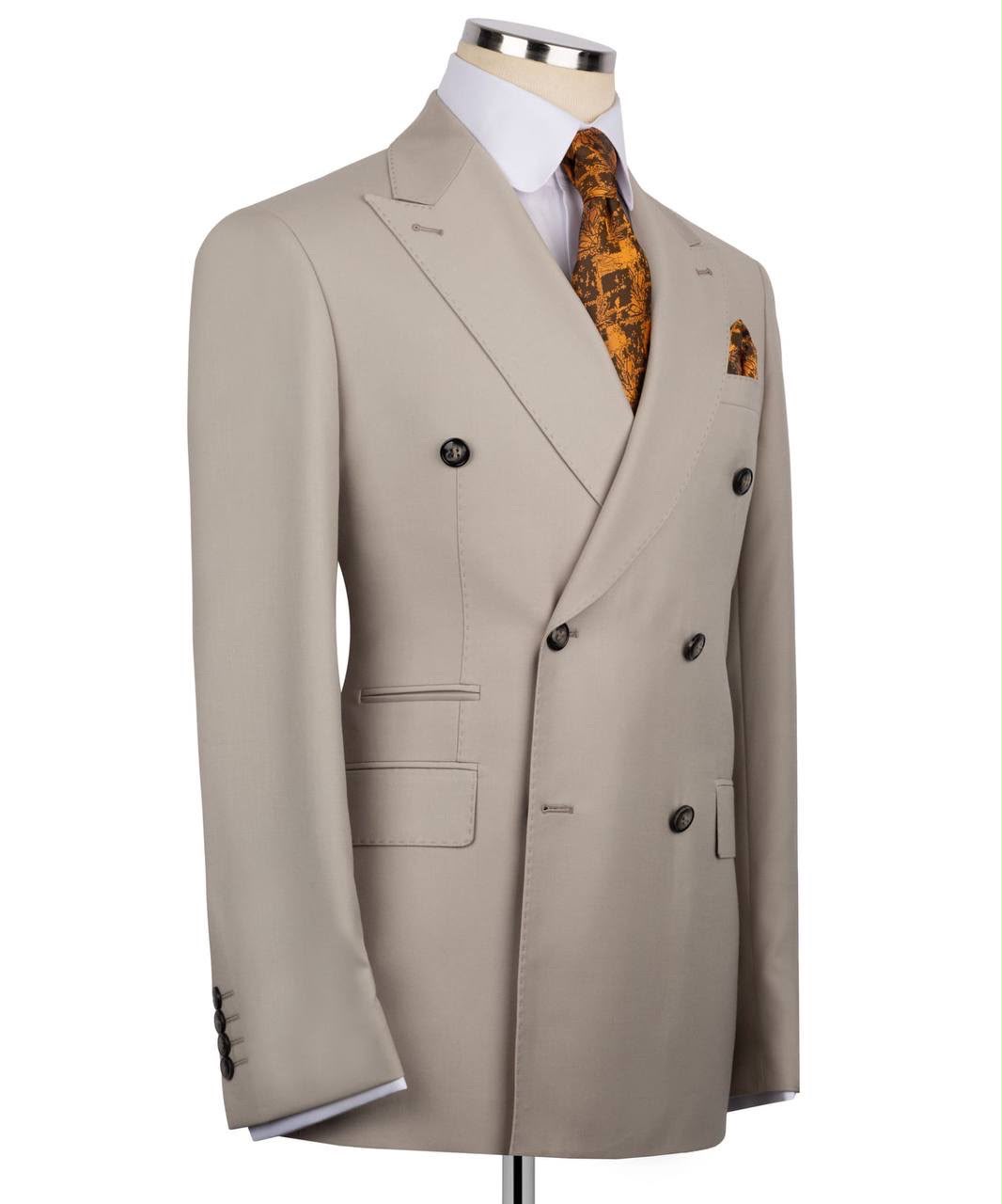 Beige double-breasted suit jacket on a mannequin with a white background