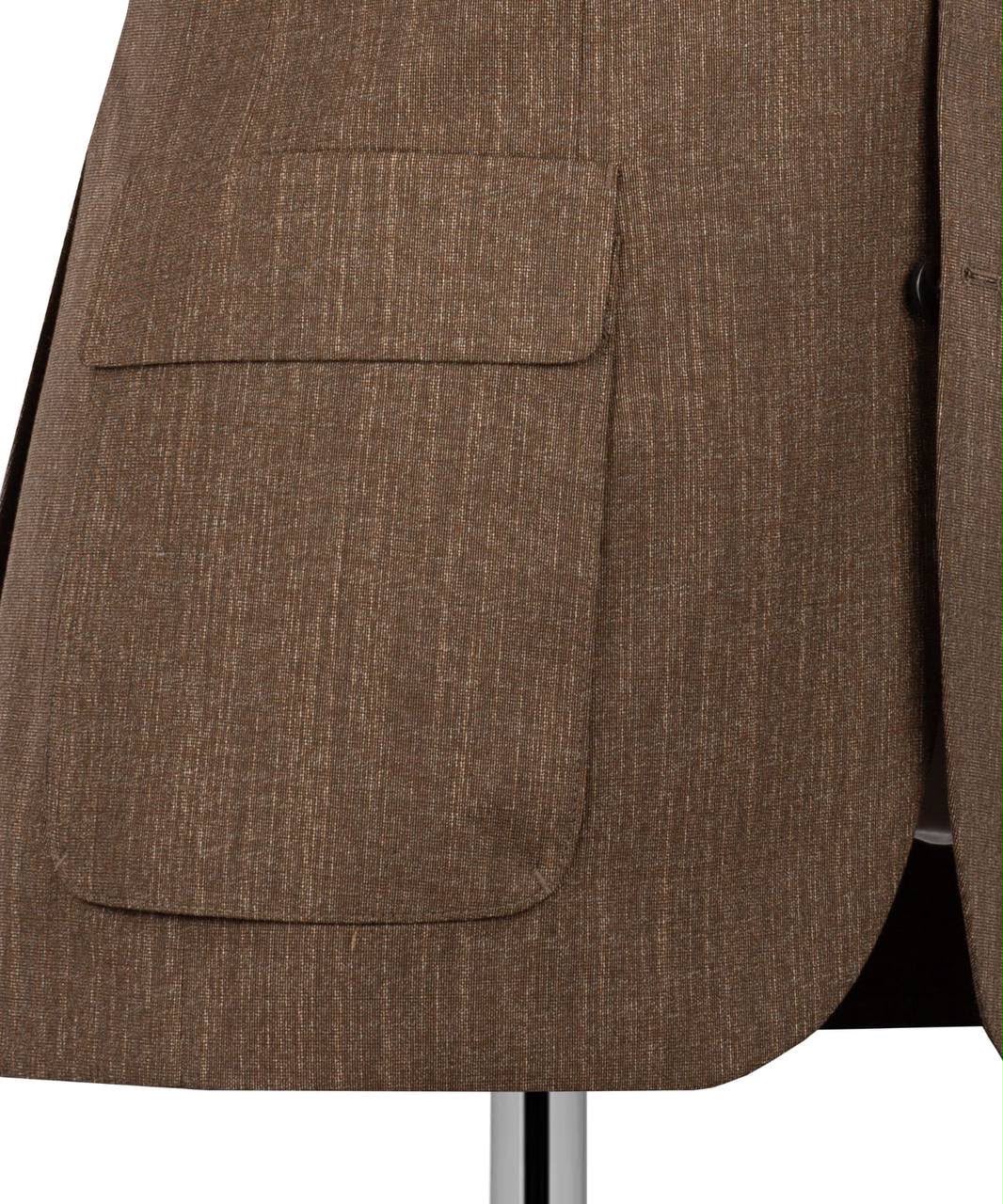 Close-up of a brown textured suit jacket showing a front flap pocket and part of the lapel on a white background.