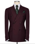 Burgundy double-breasted suit jacket on a mannequin with a white shirt and green patterned tie and pocket square.