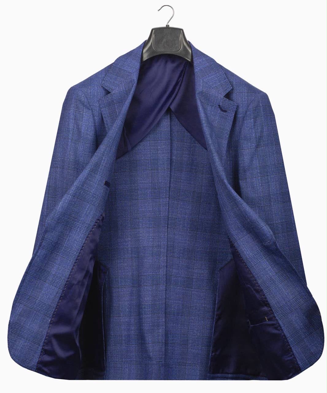 Blue checkered suit jacket on a hanger 