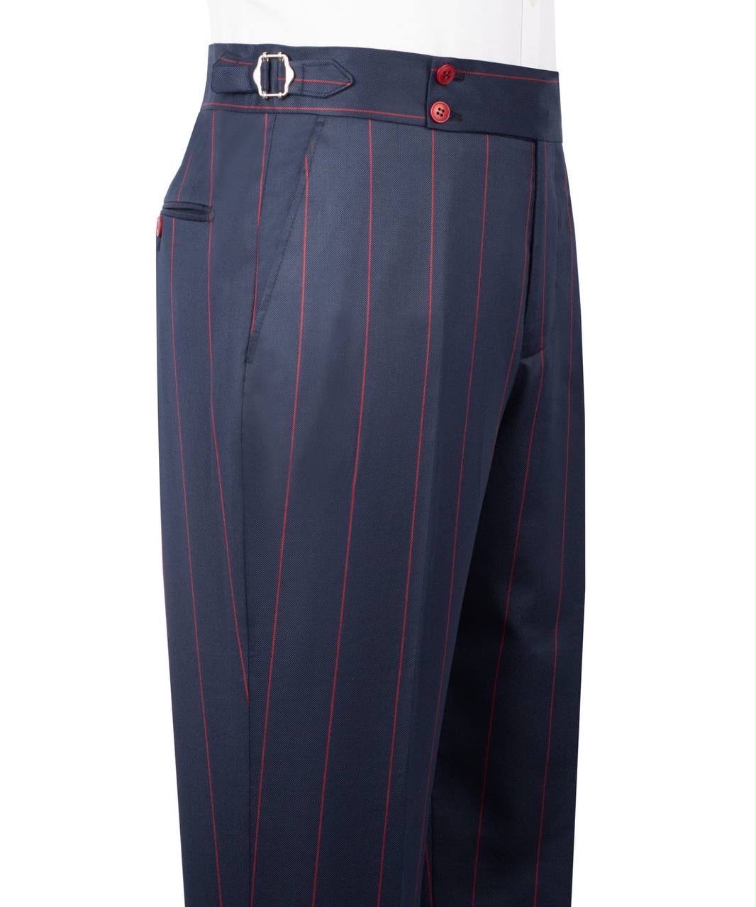 Close-up of navy blue trousers with thin red pinstripes, featuring a belt loop with a silver buckle, red buttons, and side pockets, shown on a white background.