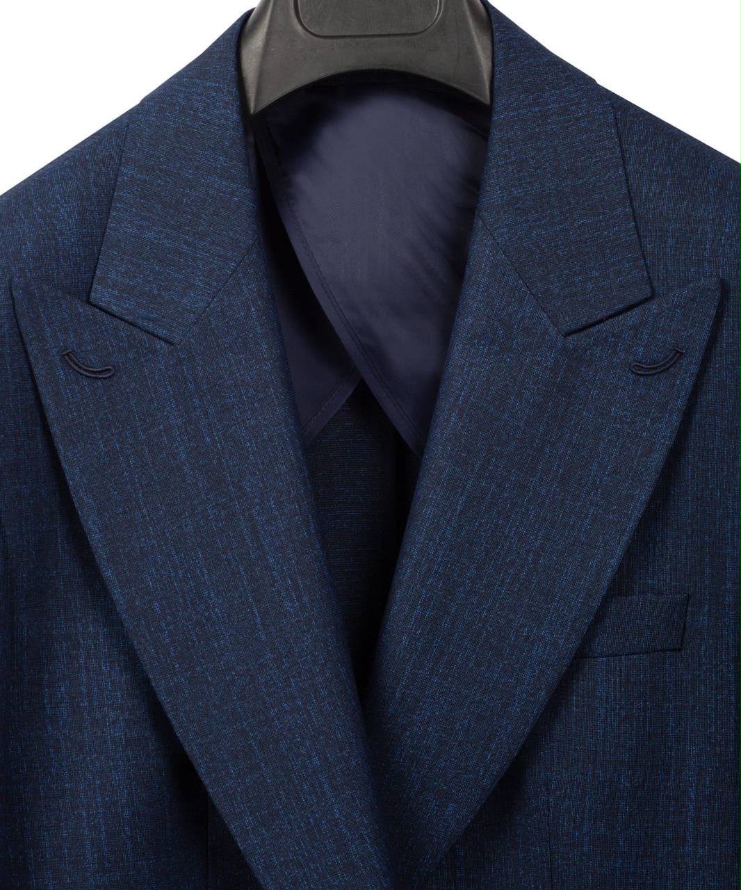 A close-up of a textured navy blue suit jacket with notched lapels, displayed on a black hanger against a white background.