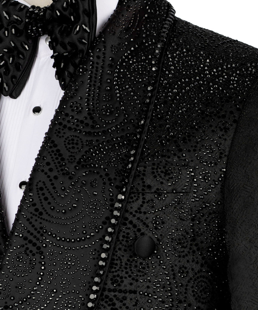 Close-up of black embroidered, beaded vest with patterned embellishments and bow tie