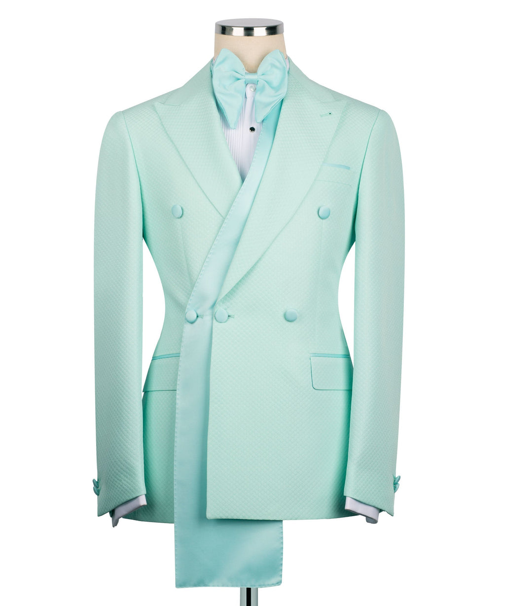 Long shawl lapel tuxedo jacket in light teal with bow and double-breasted styling