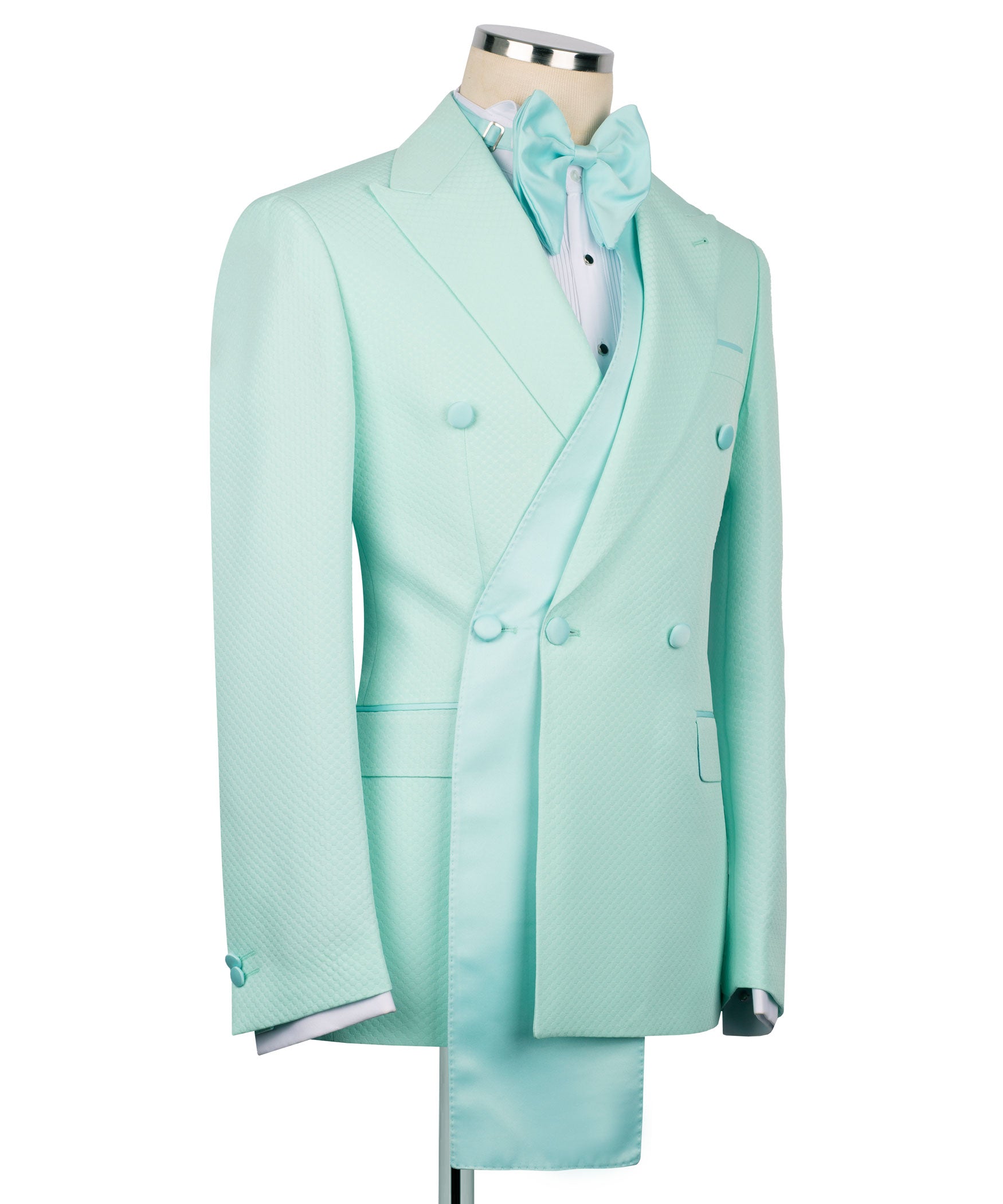 Light teal long tuxedo jacket with shawl lapels, bow tie, and four-button front