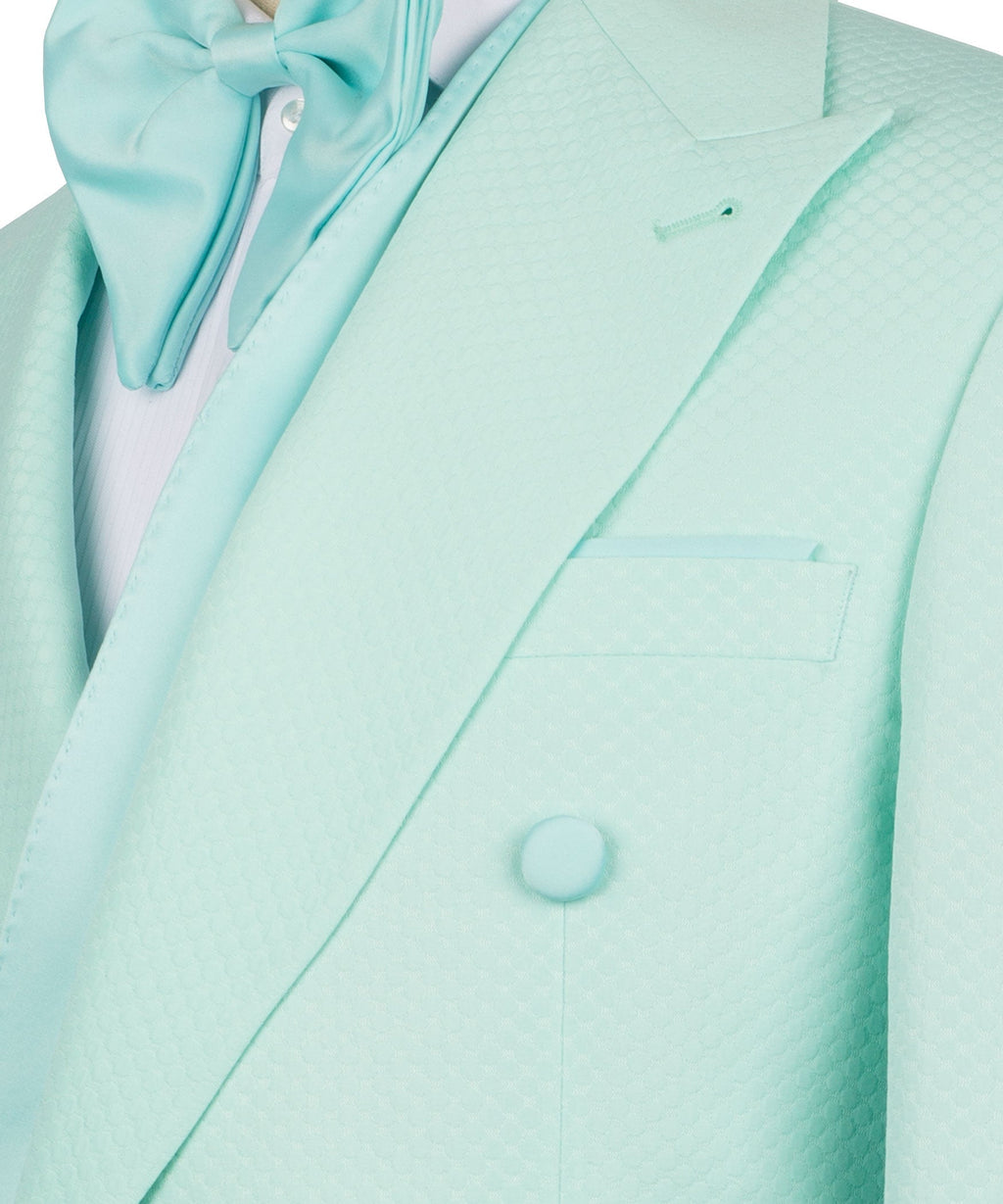 Light teal tuxedo jacket close-up: shawl lapel, chest pocket, and button details