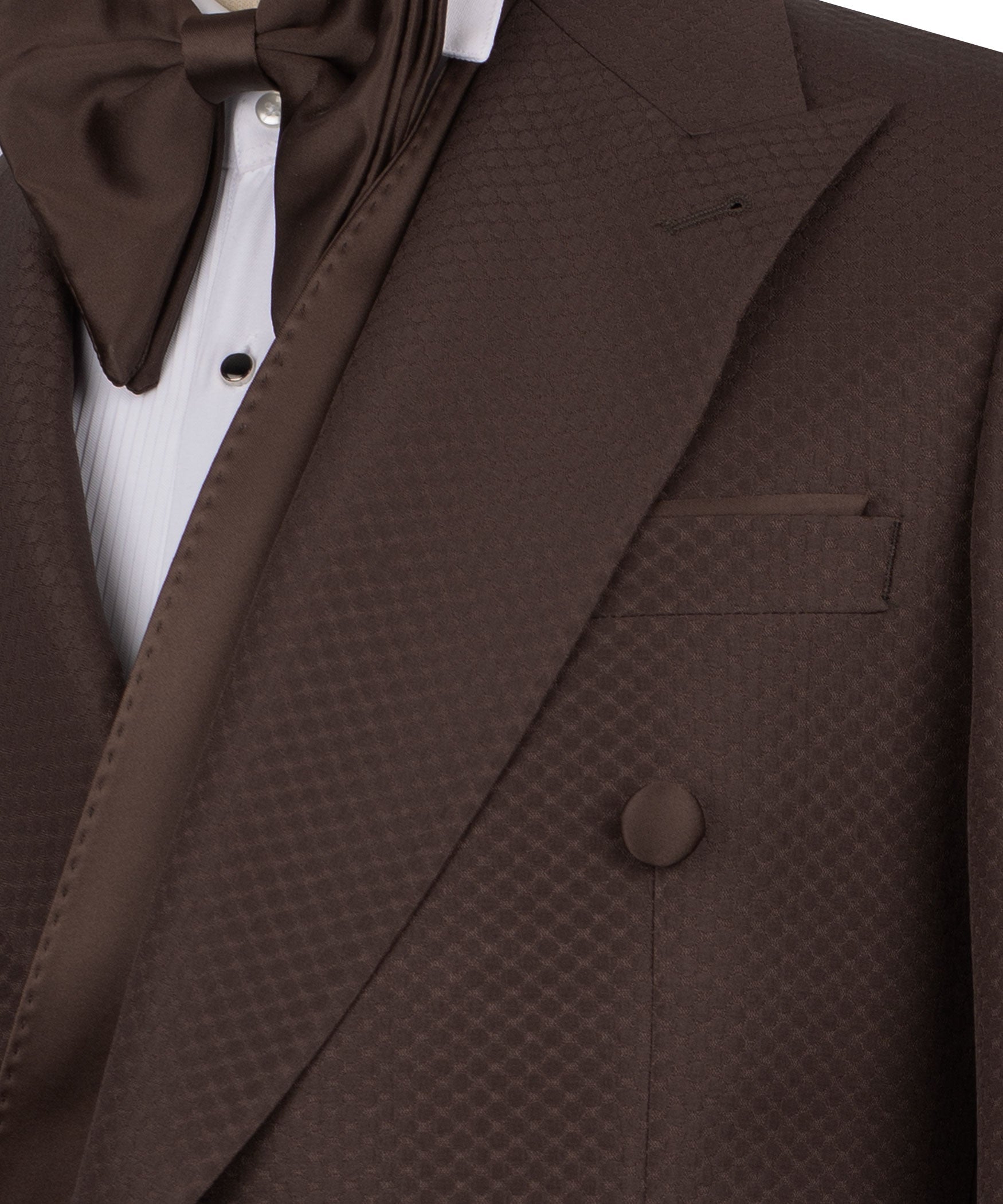 Close-up of brown shawl lapel tuxedo jacket with matching vest pocket and bow tie