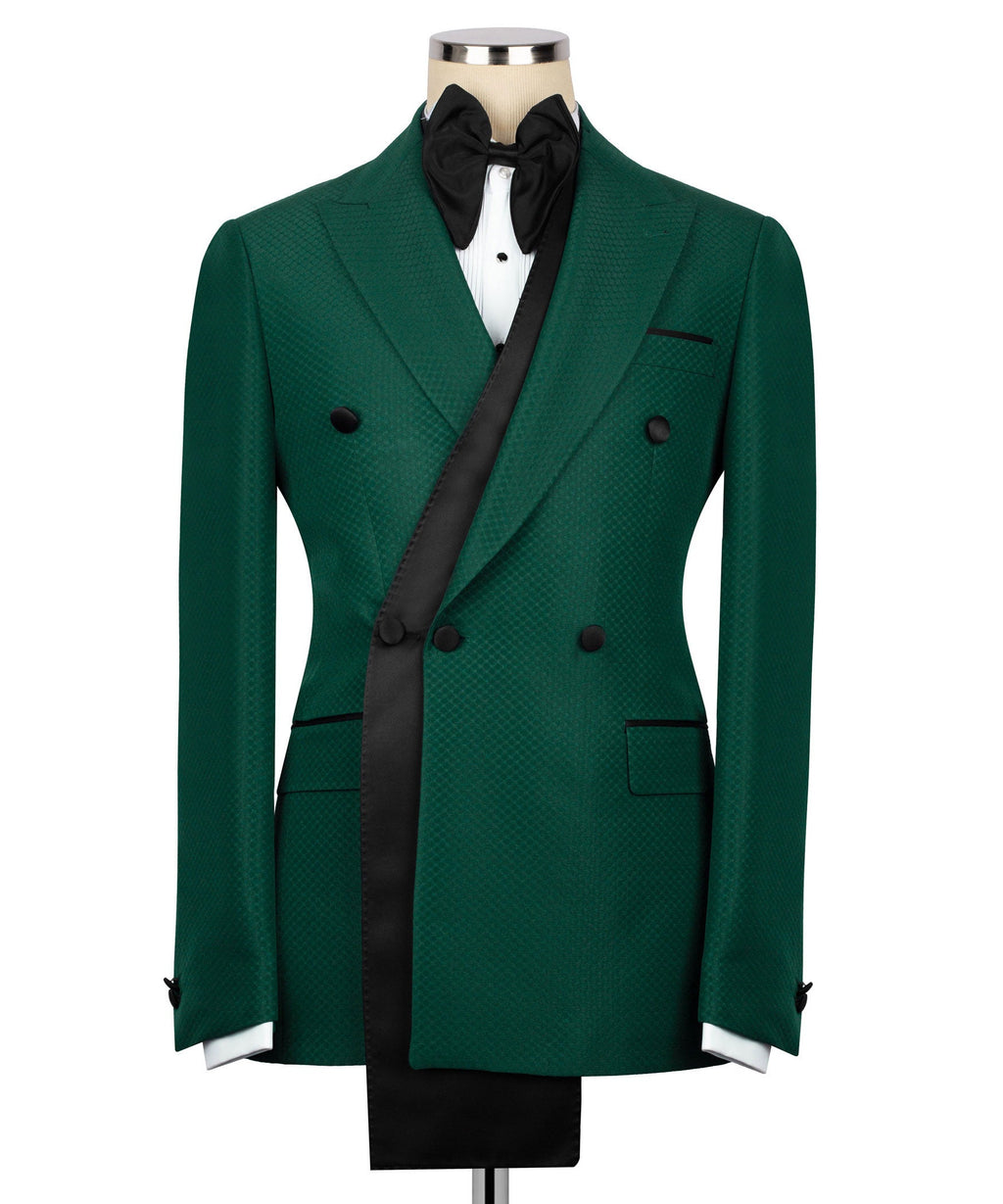 Green tuxedo jacket set with long satin lapels, black bow tie, and matching vest