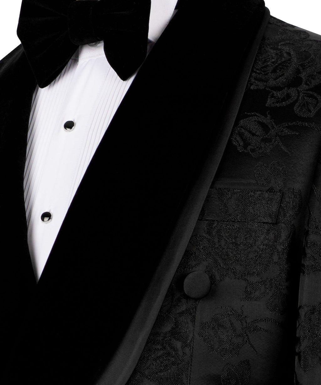 Close-up: black tuxedo lapel, velvet bow tie, satin shirt front buttons
