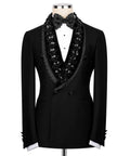Black tuxedo jacket with stone-embellished satin lapels and matching bow tie