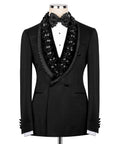 Black tuxedo jacket with stone-embellished lapels and beaded floral trim