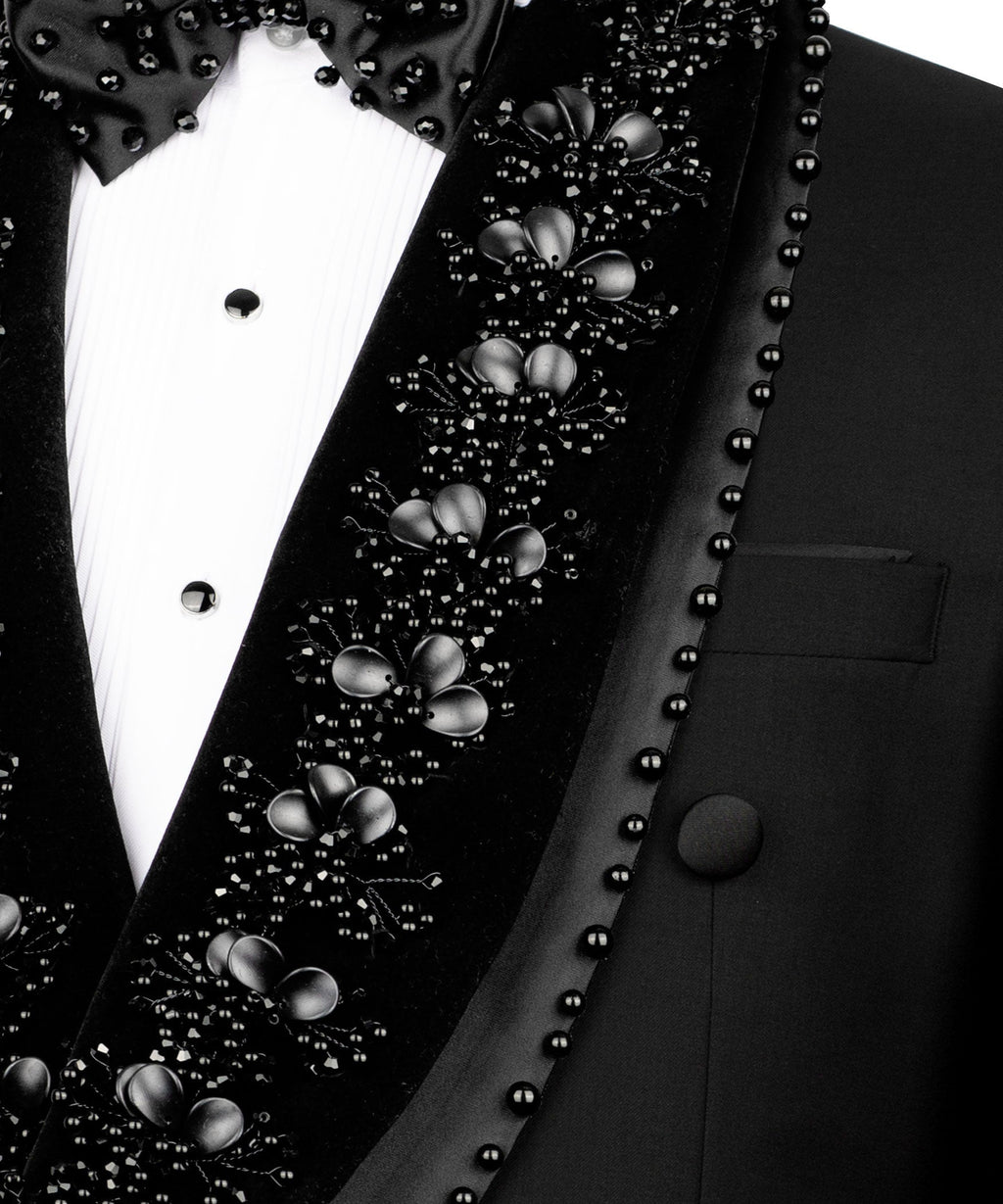 Close-up: black stone embroidery on tuxedo lapel with bead trim and button