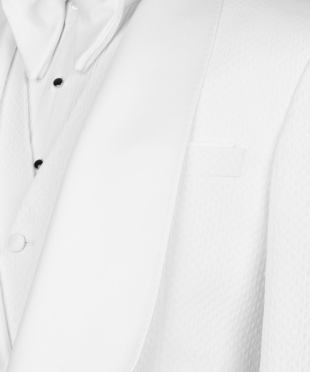 Close-up of white waistcoat lapel with black buttons and chest welt pocket