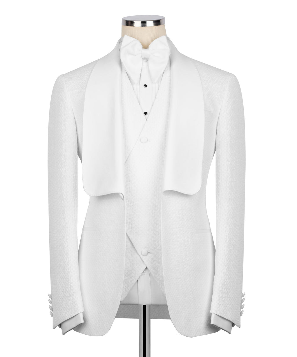 White tuxedo jacket, matching waistcoat and bow tie set on mannequin