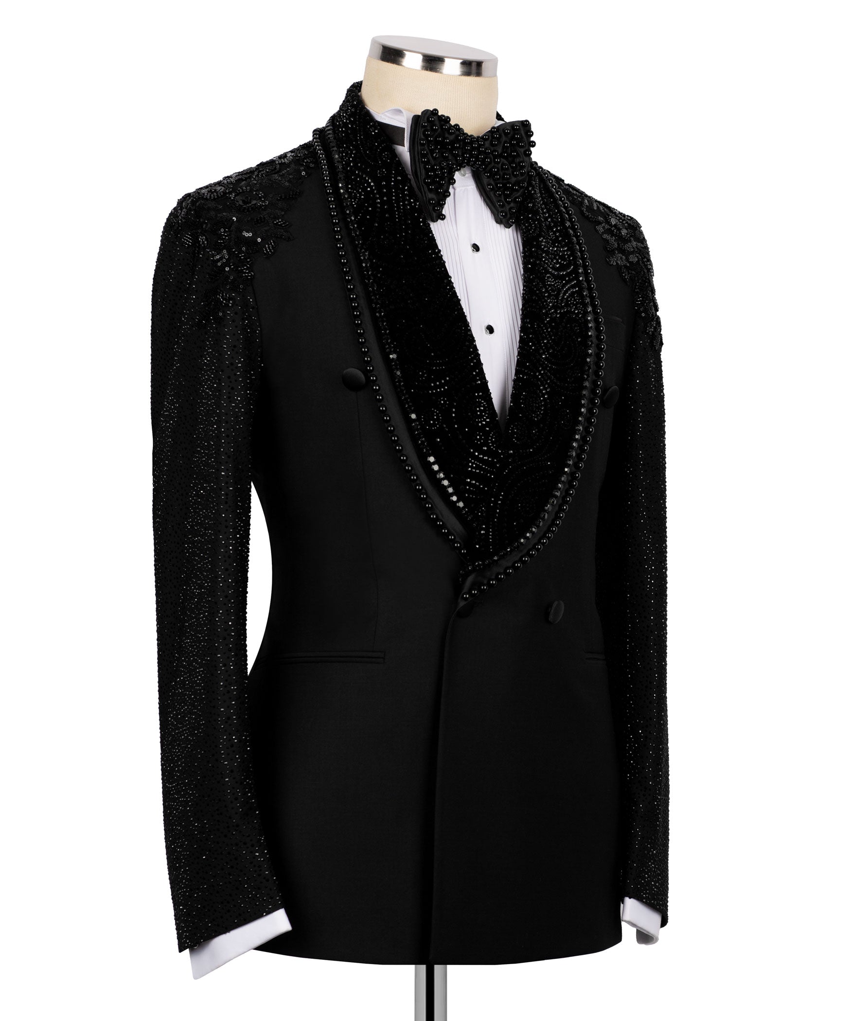 Black tuxedo jacket with jeweled embroidery, bow tie, and satin-faced lapels