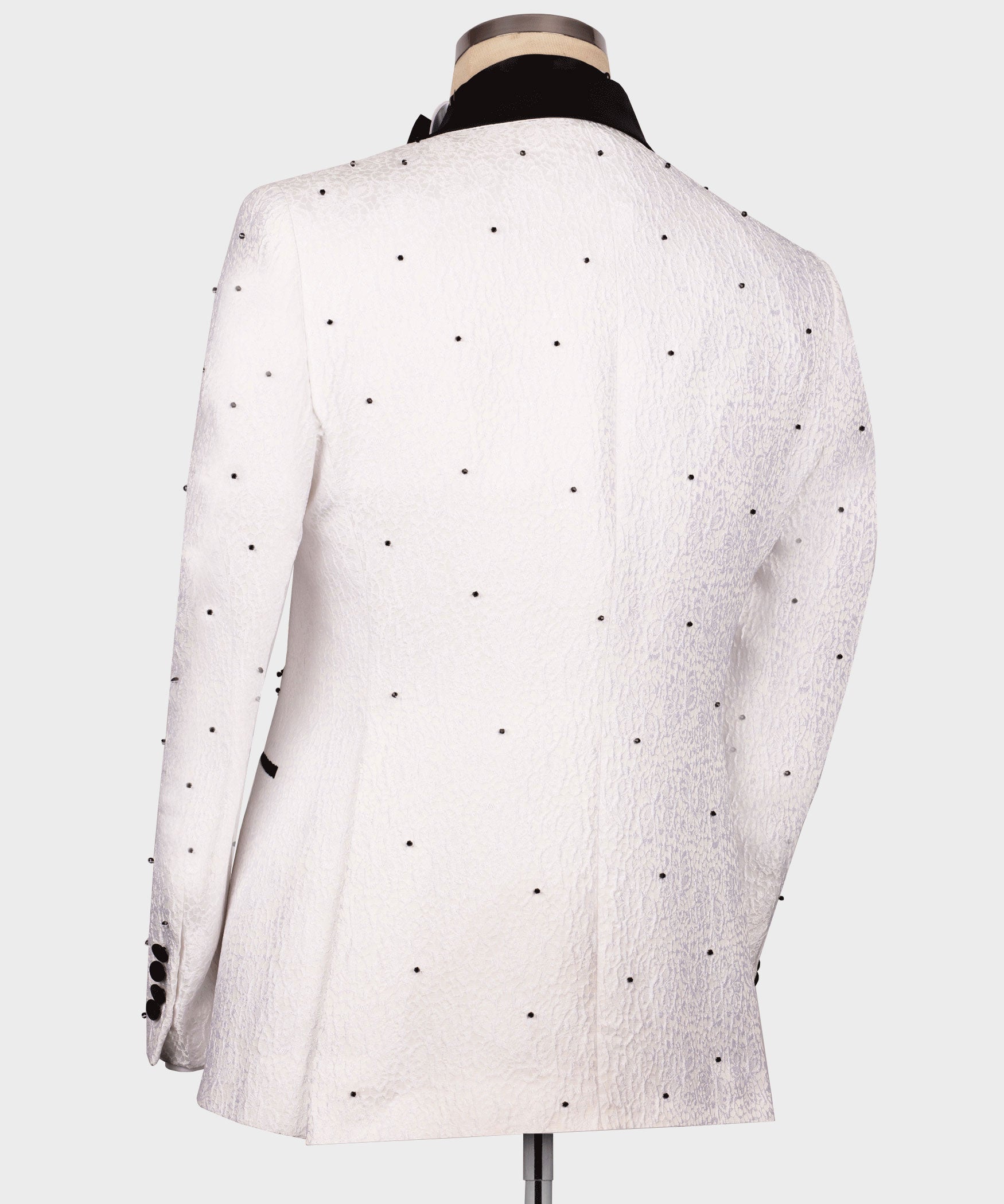 Back view of white tuxedo jacket with small black dot pattern