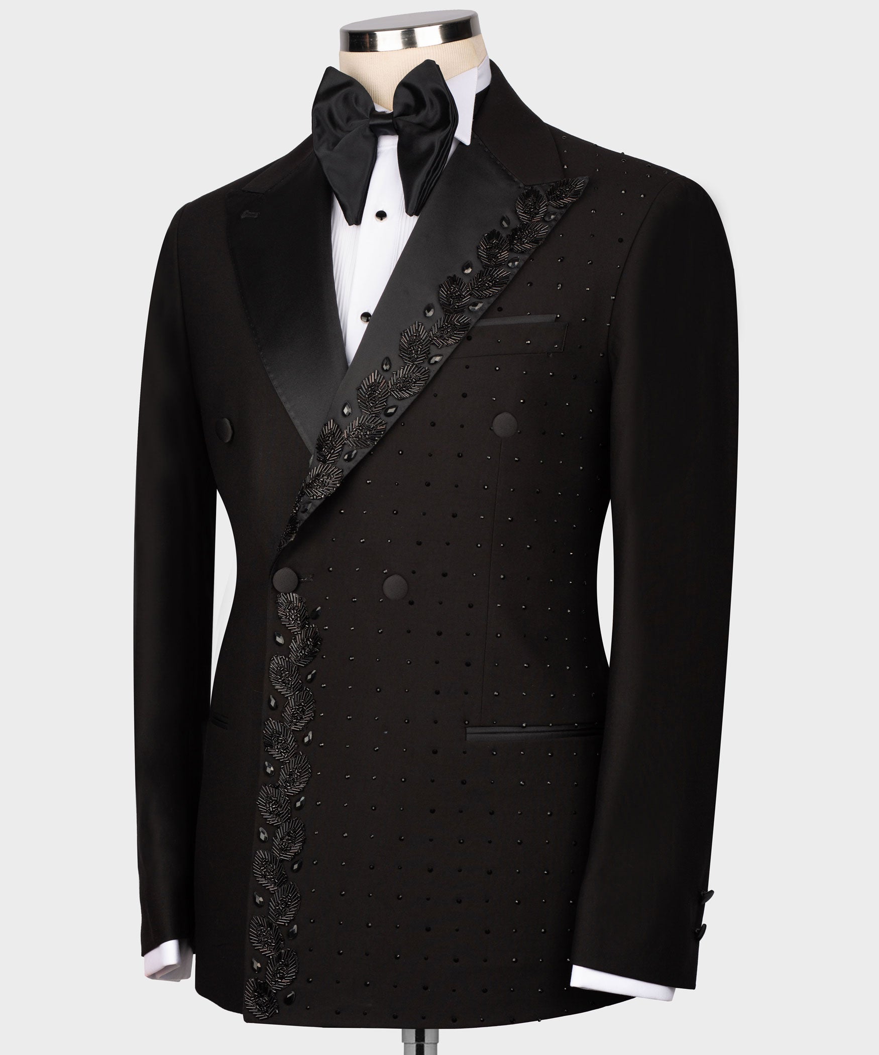 Black tuxedo jacket with bow tie, dotted sequin detail, and satin-trimmed lapel