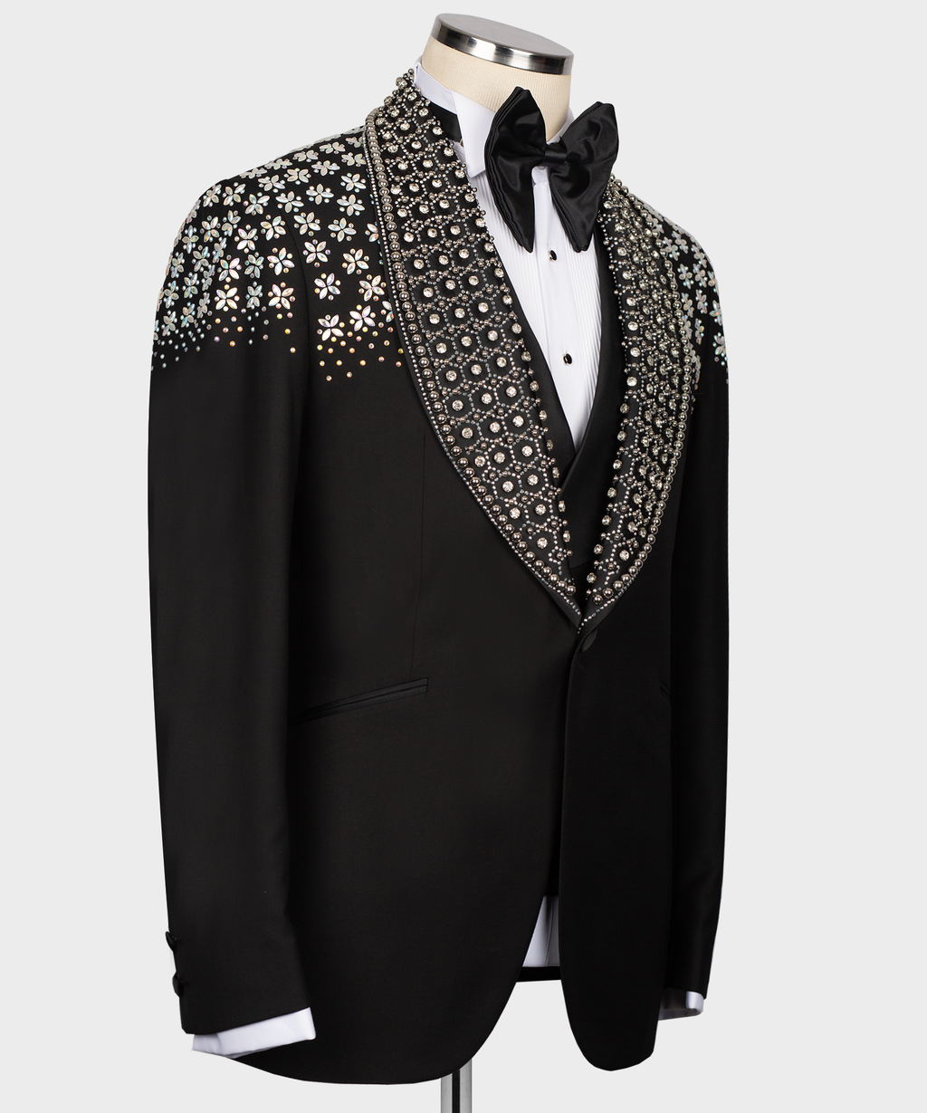 Black tuxedo jacket with stone-embroidered shawl lapel and bow tie, angled view
