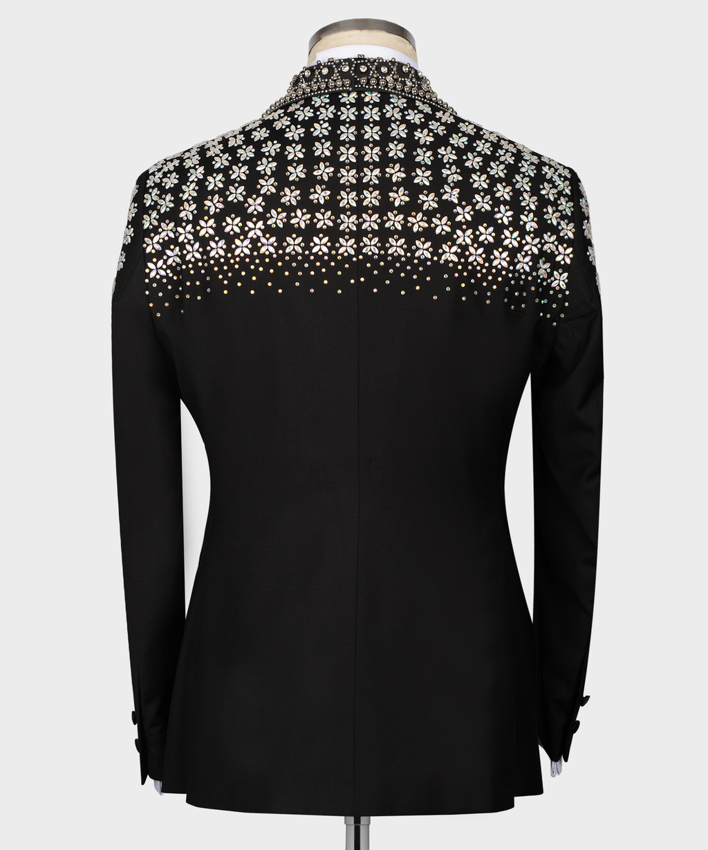 Back view of black tuxedo jacket with floral stone embroidery across the shoulders