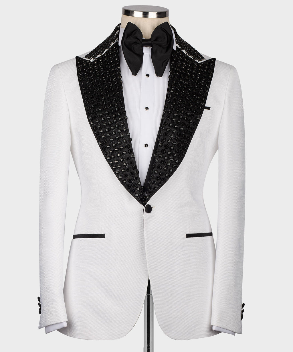 White tuxedo jacket with black stone-embroidered lapels and bow tie, front view