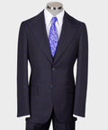 Men’s dark windowpane vest suit with purple paisley tie and matching jacket