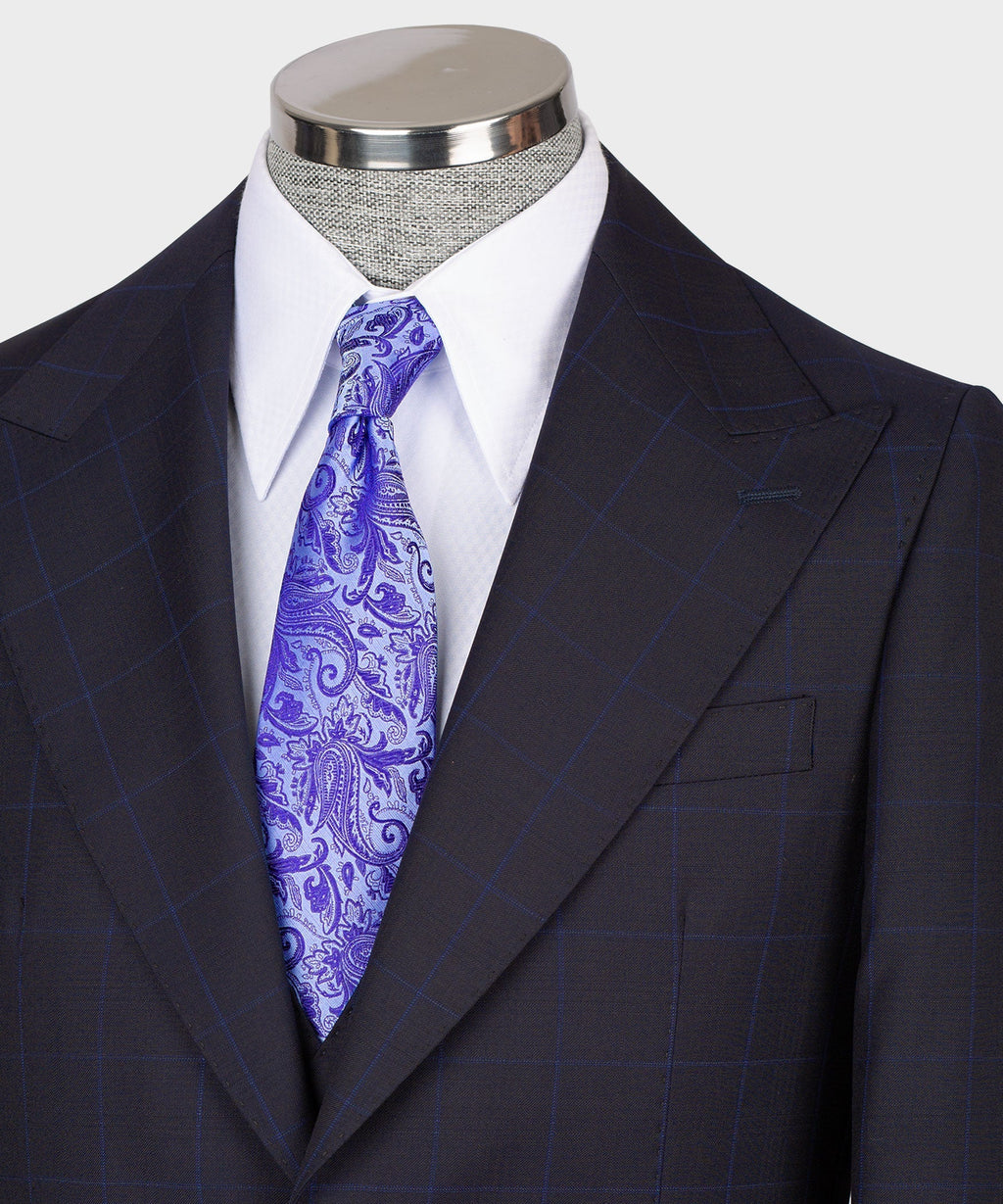 Dark vest suit lapel and vest front with purple paisley tie