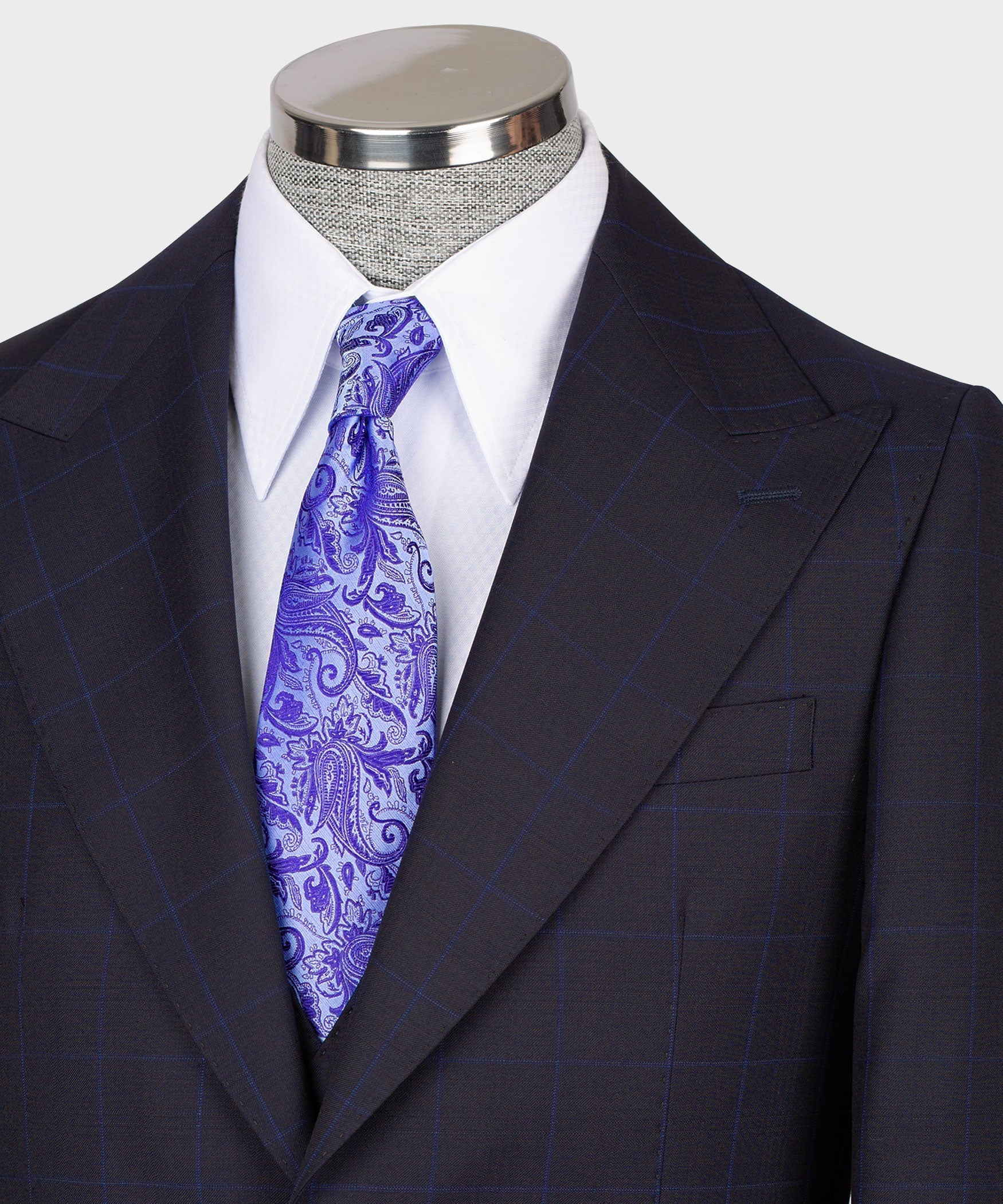 Dark vest suit lapel and vest front with purple paisley tie